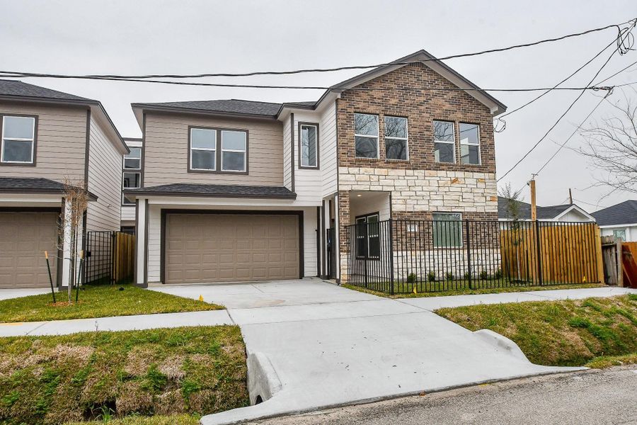 Front exterior of a new home in , Houston, TX, highlighting curb appeal (Image 17).