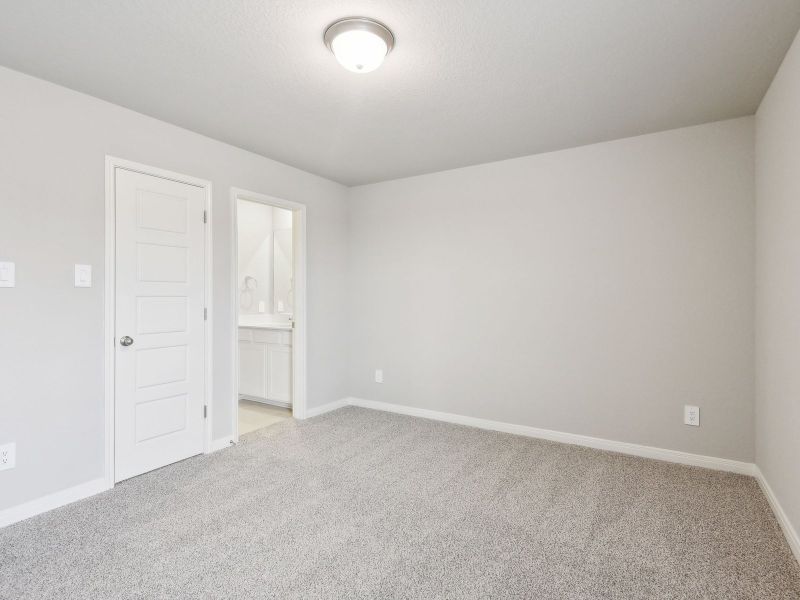 Guest bedroom in the San Jacinto floorplan at a Meritage Homes community.