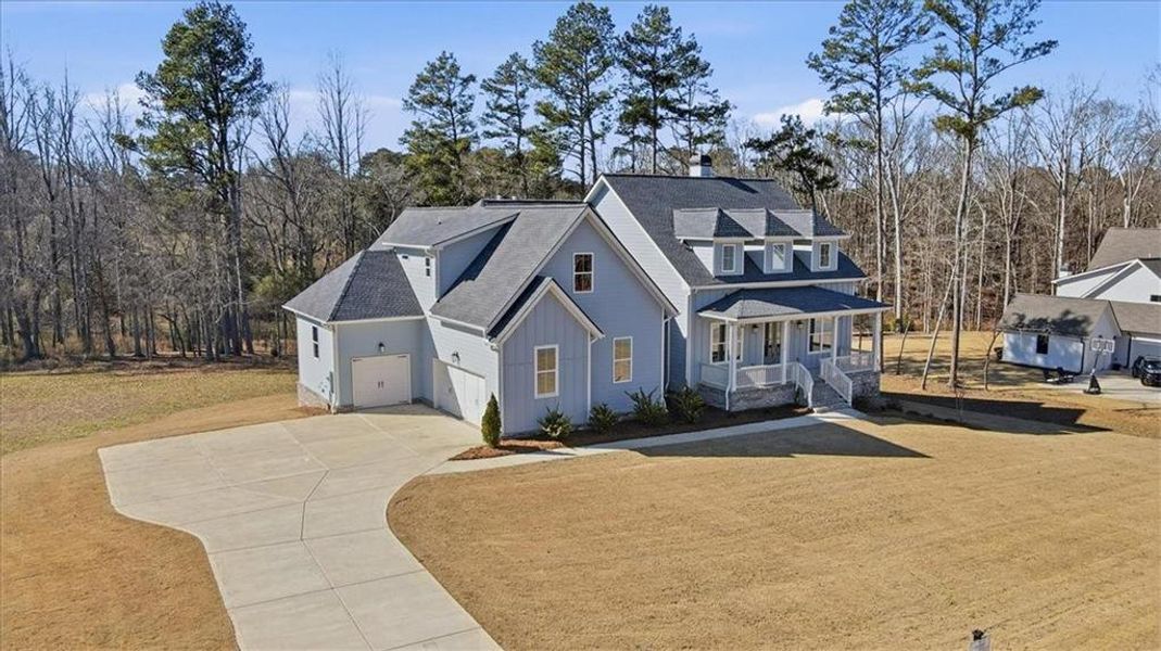 Front exterior of a new home in Old Town Estates, Monroe, GA, highlighting curb appeal (Image 30). Front exterior of a new home in Old Town Estates, Monroe, GA, highlighting curb appeal (Image 30).