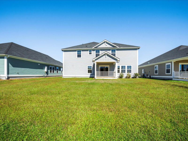 Exterior details and patio area of a home in The Coves at Lakes of Cane Bay II, Summerville (Image 25).