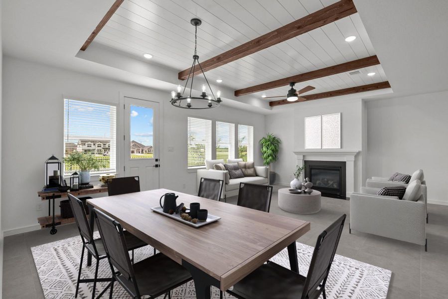 Impressive great room and dining area with cozy fireplace