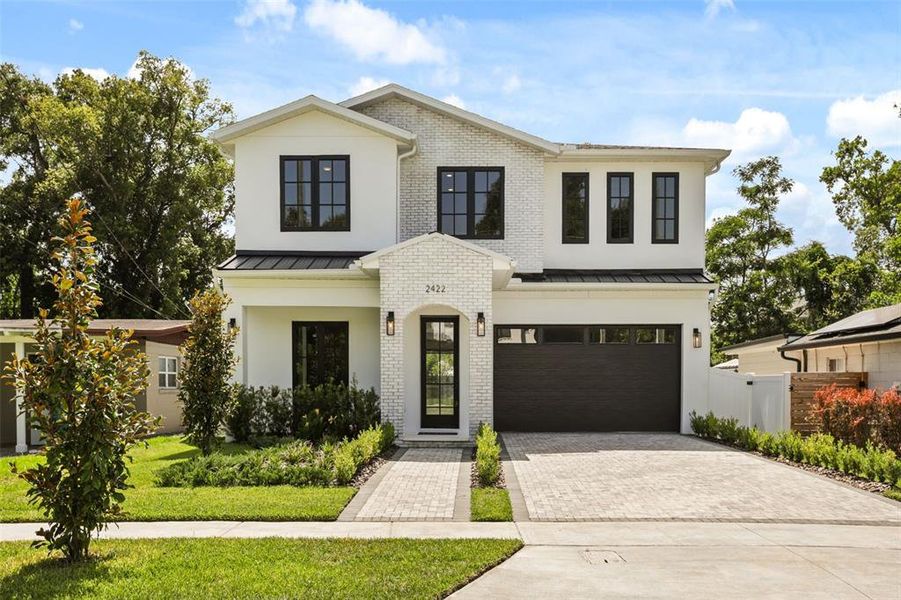 Front exterior of a new home in College Park, Orlando, FL, highlighting curb appeal (Image 1). Front exterior of a new home in College Park, Orlando, FL, highlighting curb appeal (Image 1).