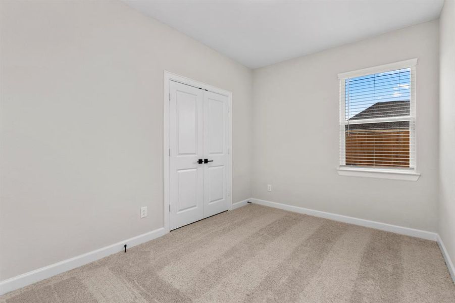 One of the three additional bedrooms in the home.