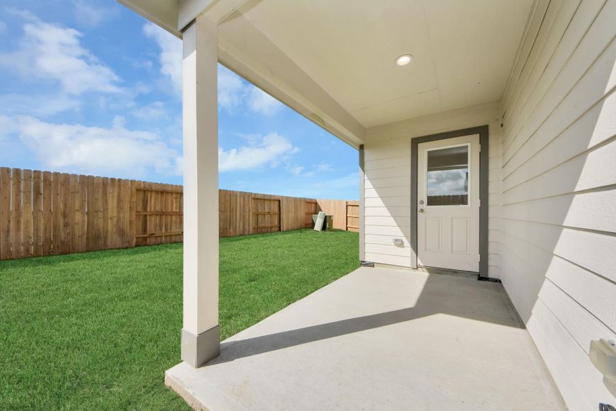 Experience outdoor living at its finest on this expansive covered patio, thoughtfully designed for BBQs and delightful outdoor dining.