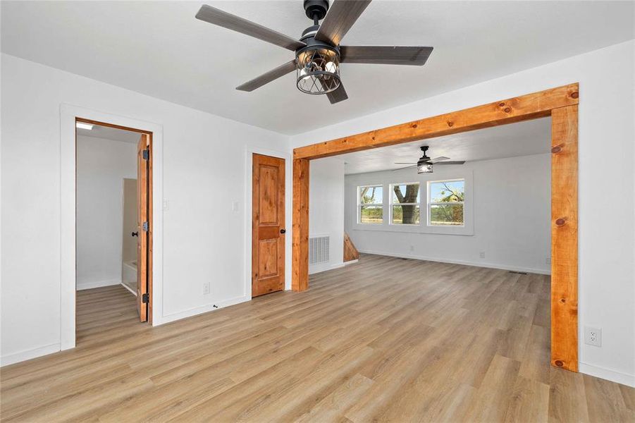Unfurnished bedroom featuring light wood-style floors and ceiling fan