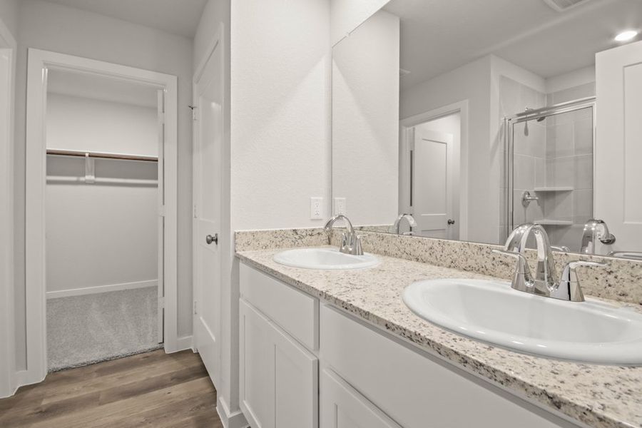 A bathroom with a large mirror. A bathroom with a large mirror.