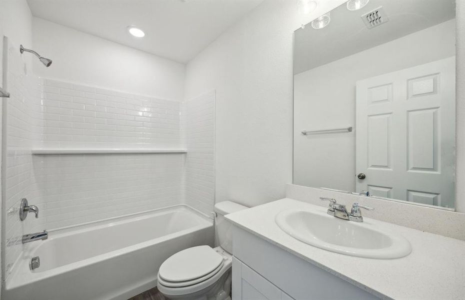 Spacious bathroom with oversized shower*real home pictured