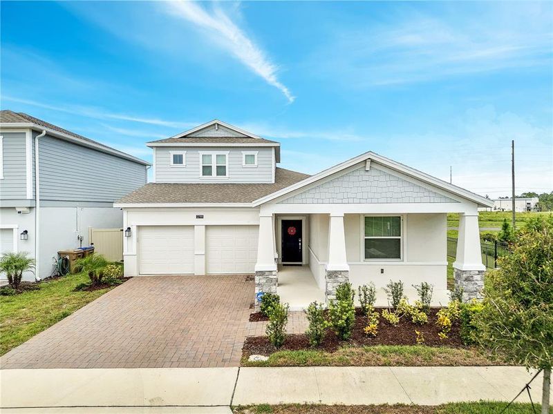 Front exterior of a new home in , St. Cloud, FL, highlighting curb appeal (Image 20).