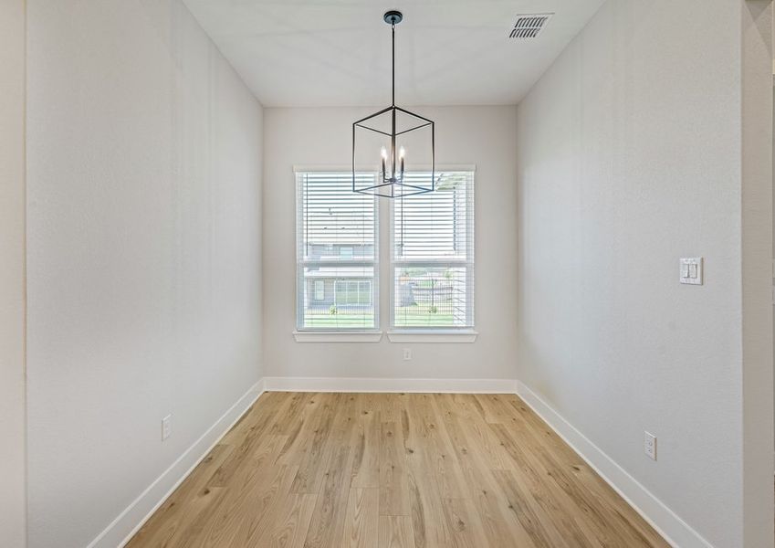 The breakfast area sits right off of the kitchen and has a large window.