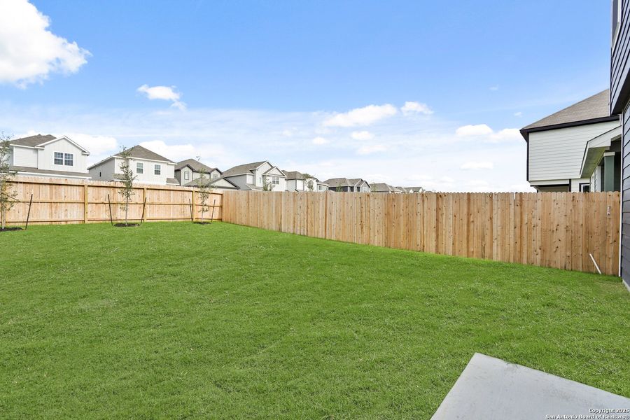 Front exterior of a new home in Melissa Ranch, San Antonio, TX, highlighting curb appeal (Image 19).