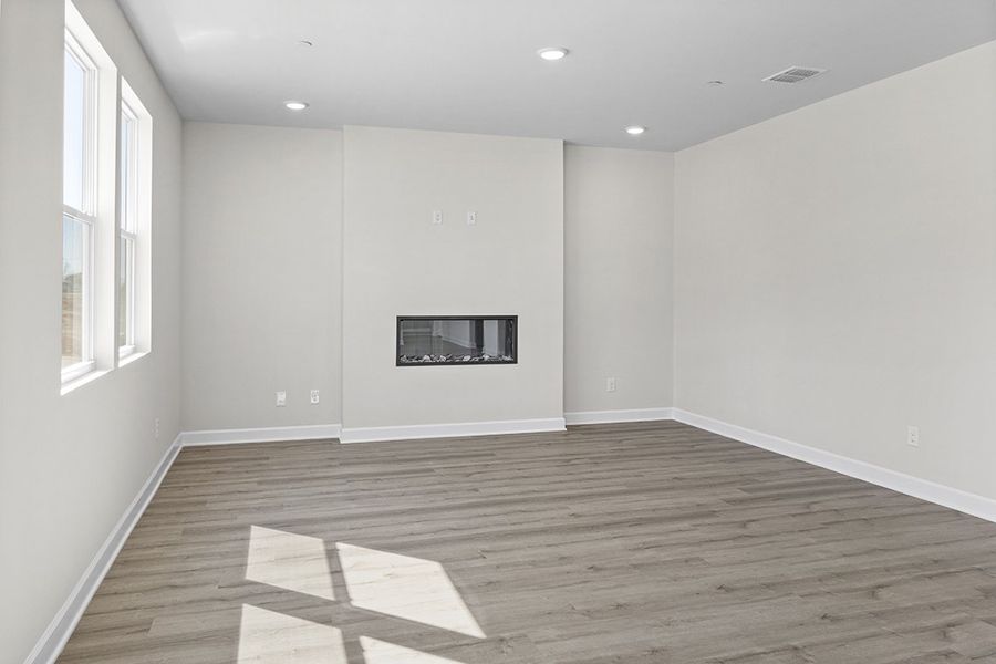A room with a wood floor and white walls. A room with a wood floor and white walls.