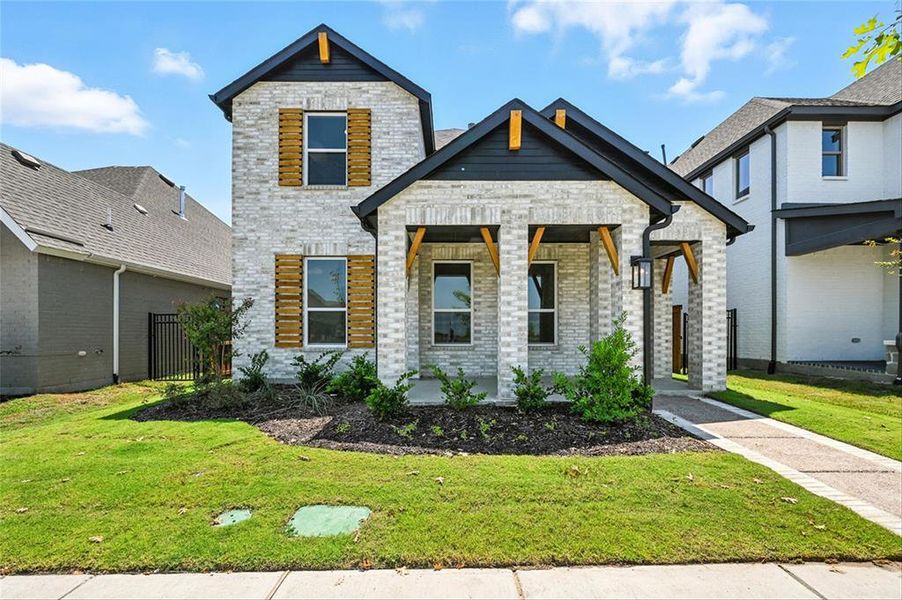 Front exterior of a new home in Talia, Mesquite, TX, highlighting curb appeal (Image 1).