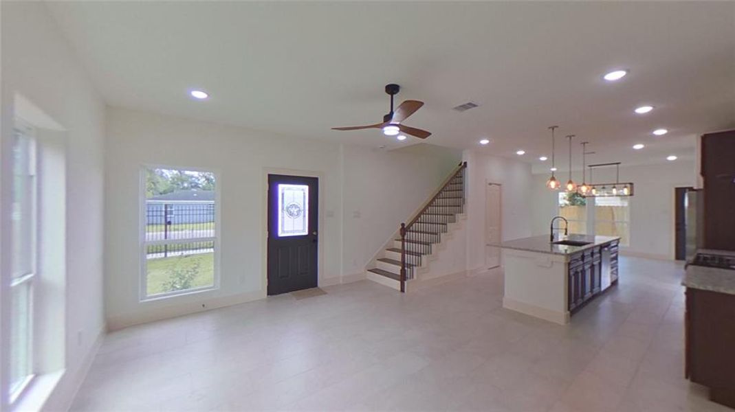 4209 Tampico St.Natural light fills the large living space and accentuates the porcelain floors.