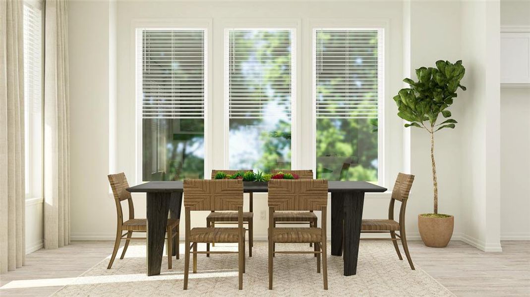 Dining area with light wood-type flooring