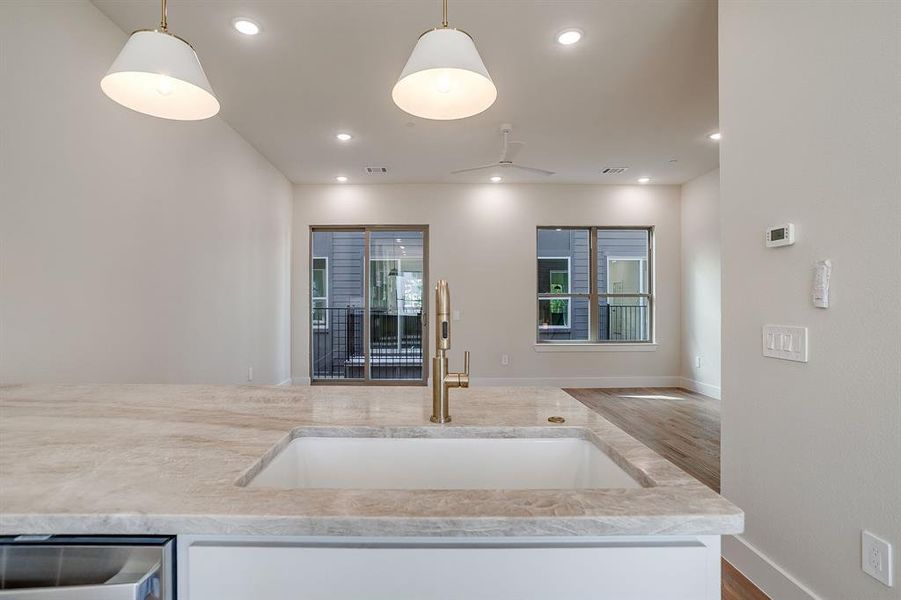 Open-concept kitchen seamlessly connecting to the living and dining areas for effortless entertaining. Open-concept kitchen seamlessly connecting to the living and dining areas for effortless entertaining.