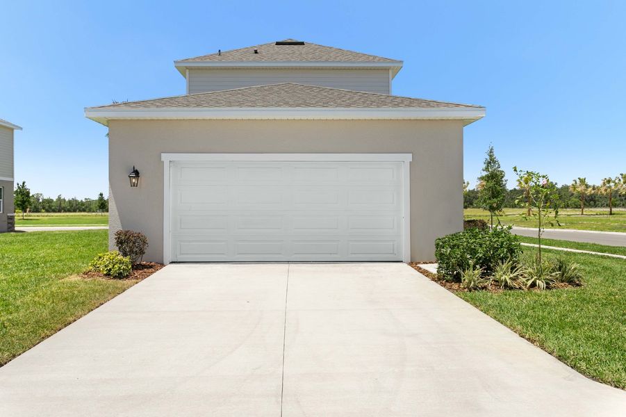 Front exterior of a new home in Brack Ranch, St. Cloud, FL, highlighting curb appeal (Image 29). Front exterior of a new home in Brack Ranch, St. Cloud, FL, highlighting curb appeal (Image 29).