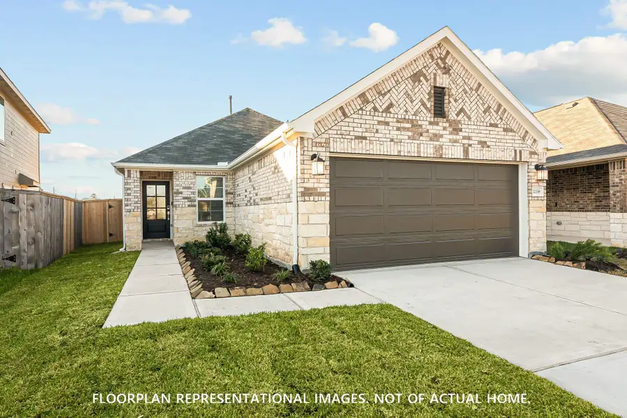 Front exterior of a new home in Lone Star Landing, Montgomery, TX, highlighting curb appeal (Image 2). Front exterior of a new home in Lone Star Landing, Montgomery, TX, highlighting curb appeal (Image 2).
