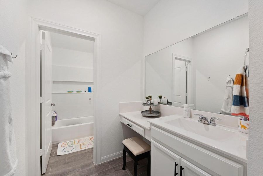 Hall bath serves two bedrooms and the game room. Hall bath serves two bedrooms and the game room.