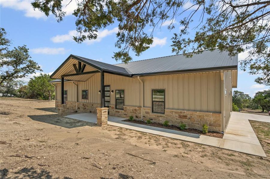 Front exterior of a new home in , Springtown, TX, highlighting curb appeal (Image 2). Front exterior of a new home in , Springtown, TX, highlighting curb appeal (Image 2).