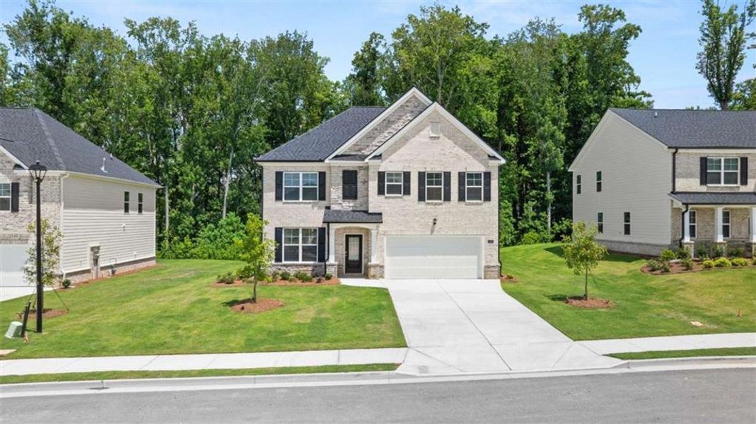 Front exterior of a new home in Independence, Loganville, GA, highlighting curb appeal (Image 2). Front exterior of a new home in Independence, Loganville, GA, highlighting curb appeal (Image 2).