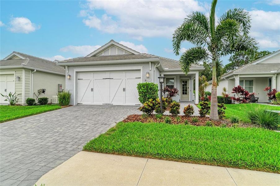 Front exterior of a new home in , Sarasota, FL, highlighting curb appeal (Image 28).