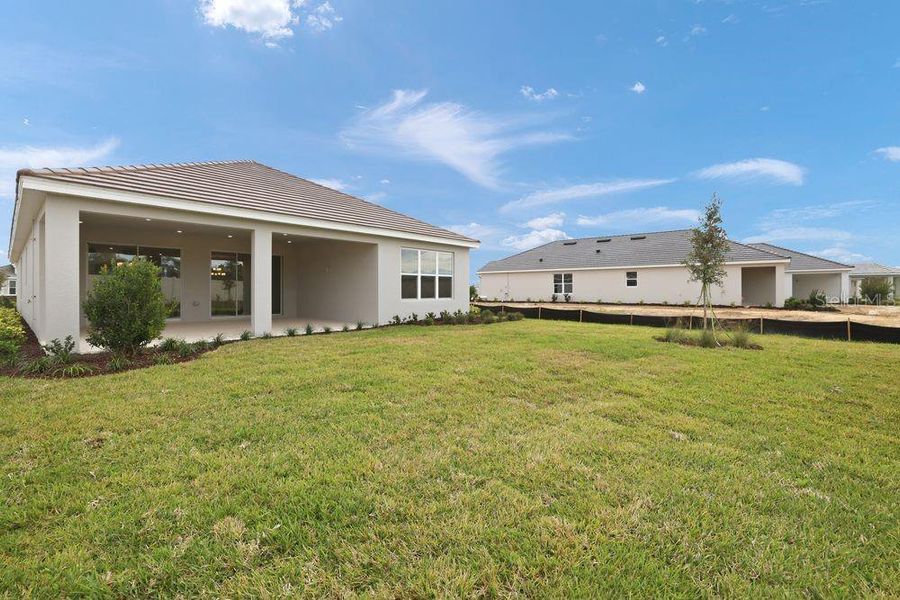 Exterior details and patio area of a home in Esplanade at Wiregrass Ranch, Wesley Chapel (Image 3).