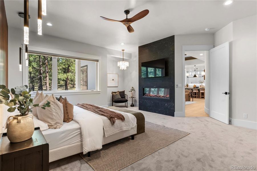 Primary Bedroom with electric fireplace and reading nook