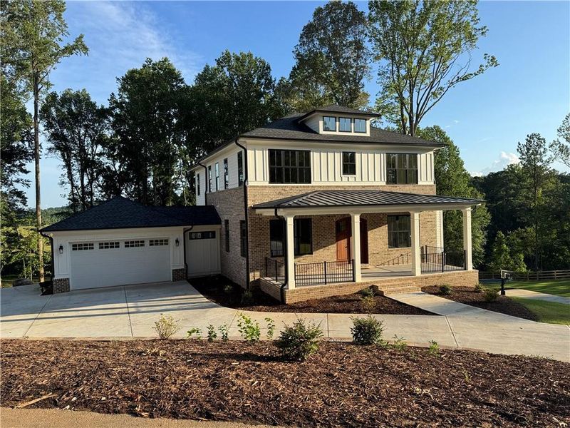 Front exterior of a new home in , Woodstock, GA, highlighting curb appeal (Image 2).