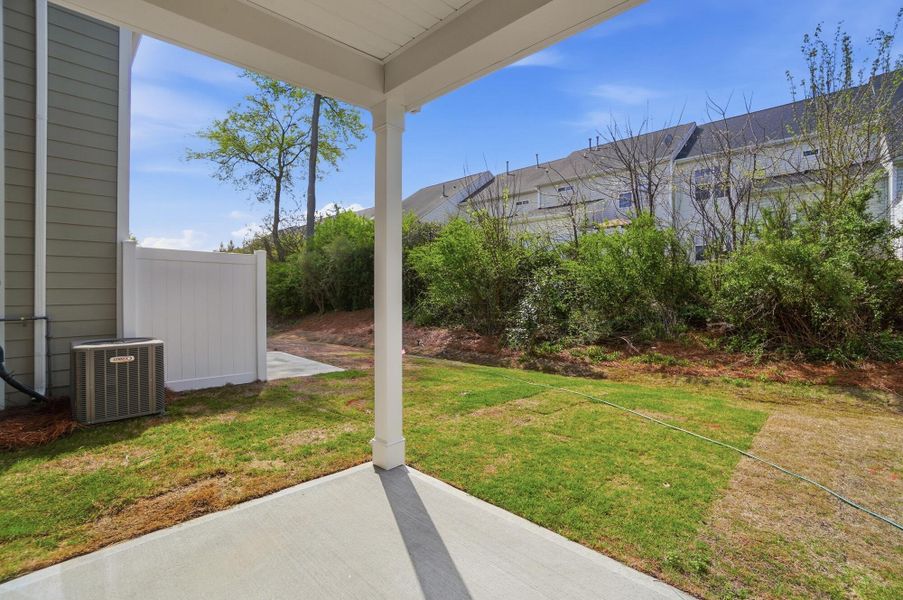 Exterior details and patio area of a home in Harrisburg Village Townhomes, Harrisburg (Image 4).