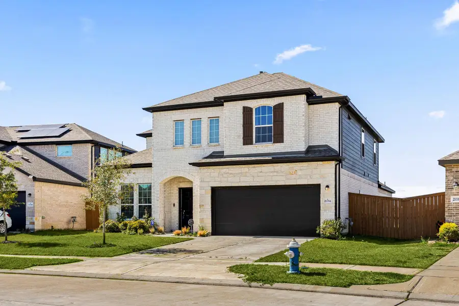 Front exterior of a new home in , Cypress, TX, highlighting curb appeal (Image 27).