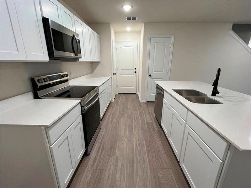 Furnished interior view inside a new home in Labein Villas, Greenville (Image 7).