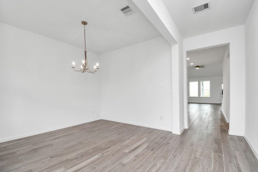 Spacious, unfurnished interior of a new home in Sunterra, Katy (Image 27).