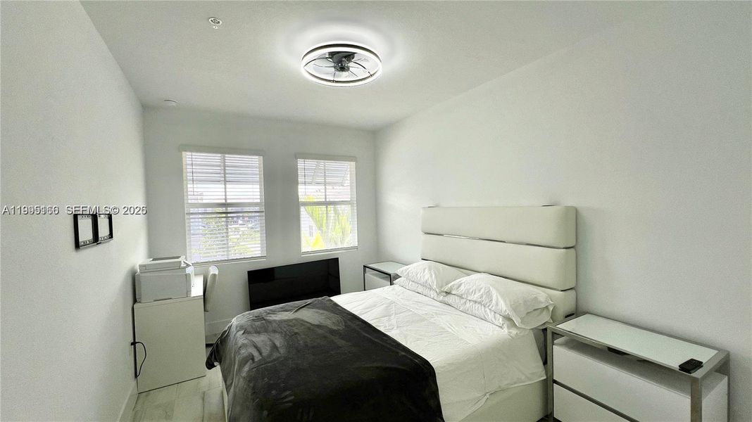 Versatile bedroom ideal for family or workspace Versatile bedroom ideal for family or workspace