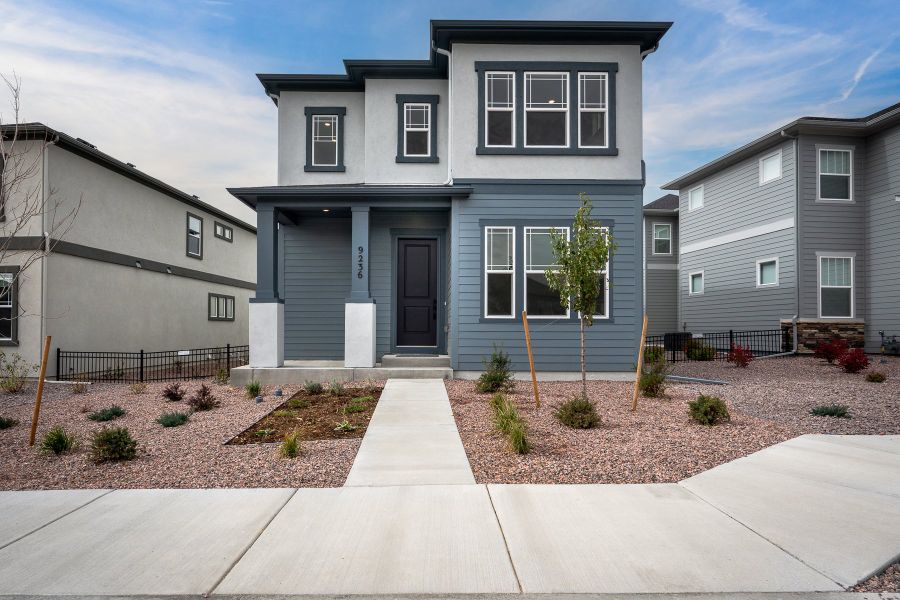Front exterior of a new home in Revel Crossing at Wolf Ranch – The Outlook Collection, Colorado Springs, CO, highlighting curb appeal (Image 2). Front exterior of a new home in Revel Crossing at Wolf Ranch – The Outlook Collection, Colorado Springs, CO, highlighting curb appeal (Image 2).
