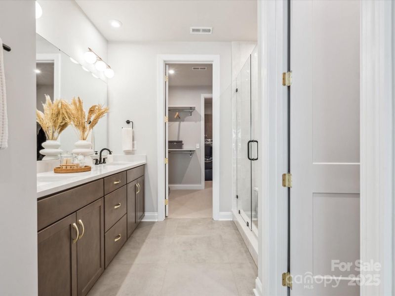 En Suite Primary Bath with Loads of Storage at Dual Vanity. *Model Photos | Actual Finishes, Structural Selections, and Orientation May Vary. En Suite Primary Bath with Loads of Storage at Dual Vanity. *Model Photos | Actual Finishes, Structural Selections, and Orientation May Vary.