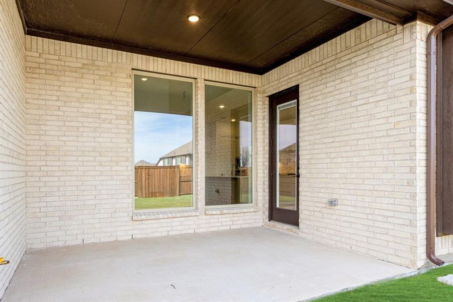 Exterior details and patio area of a home in Windsong Ranch, Prosper (Image 4).
