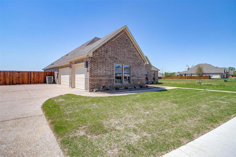 Front exterior of a new home in , Burleson, TX, highlighting curb appeal (Image 26). Front exterior of a new home in , Burleson, TX, highlighting curb appeal (Image 26).