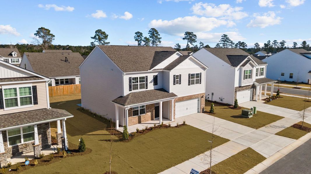 Front exterior of a new home in Ridgewood Farms, Winterville, NC, highlighting curb appeal (Image 2). Front exterior of a new home in Ridgewood Farms, Winterville, NC, highlighting curb appeal (Image 2).