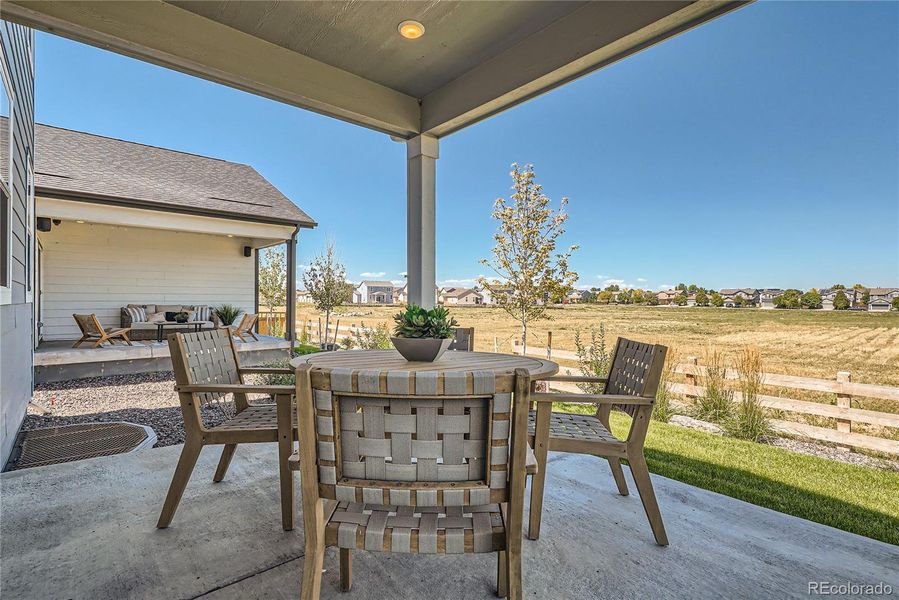 Covered patio backs to open space