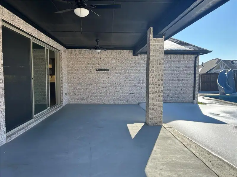 Exterior details and patio area of a home in Monterra, Fate (Image 3).