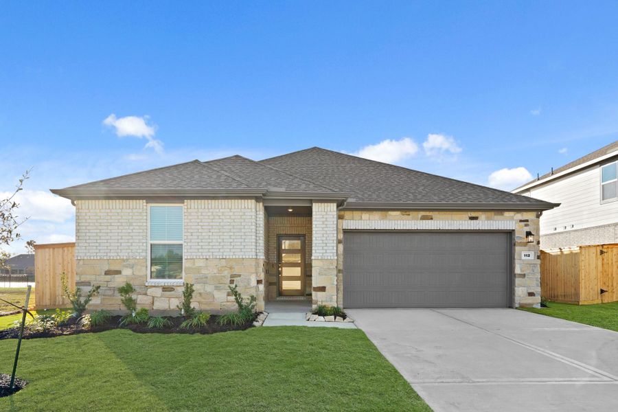 Front exterior of a new home in Woodshore, Clute, TX, highlighting curb appeal (Image 21).