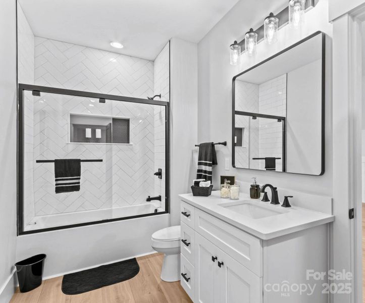 Bath 3 with tiled shower.