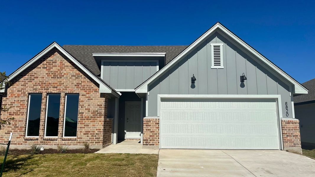 Front exterior of a new home in Mesa Ridge, Temple, TX, highlighting curb appeal (Image 1).