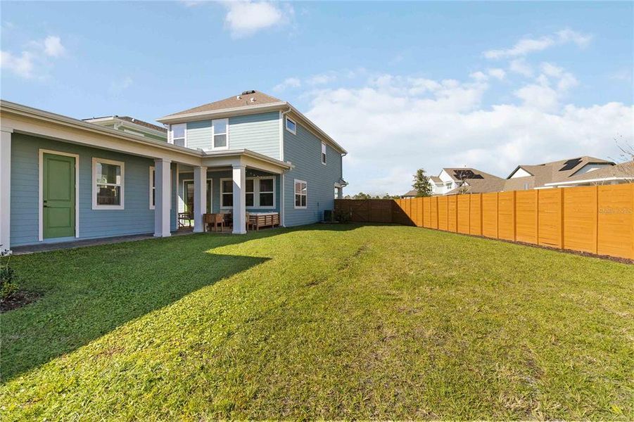Exterior details and patio area of a home in Weslyn Park at Sunbridge (Craft Homes), St. Cloud (Image 27).