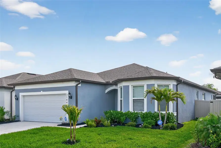 Front exterior of a new home in , Ellenton, FL, highlighting curb appeal (Image 31).