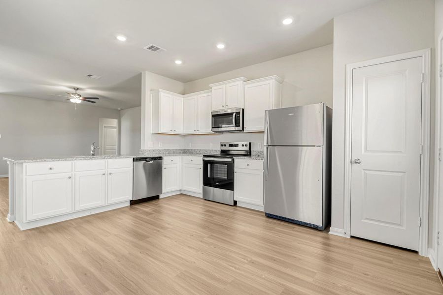 Whirlpool kitchen appliances and granite countertops make this kitchen chef-ready! Whirlpool kitchen appliances and granite countertops make this kitchen chef-ready!