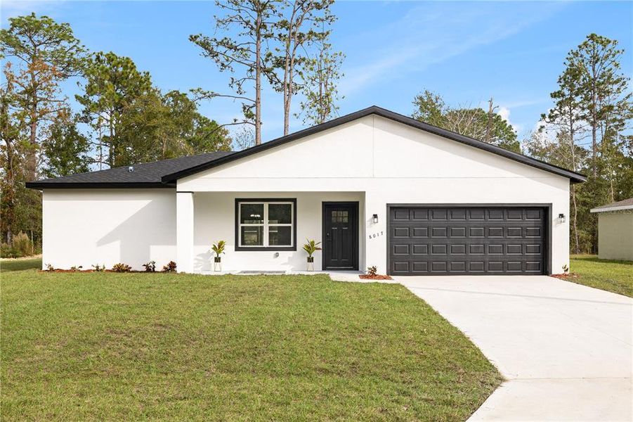 Front exterior of a new home in , Citrus Springs, FL, highlighting curb appeal (Image 27). Front exterior of a new home in , Citrus Springs, FL, highlighting curb appeal (Image 27).