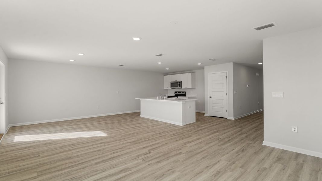Representative unfurnished interior of a home built from the The Freeport by D.R. Horton in Hodges Bayou Plantation, Panama City (Image 23). Representative unfurnished interior of a home built from the The Freeport by D.R. Horton in Hodges Bayou Plantation, Panama City (Image 23).