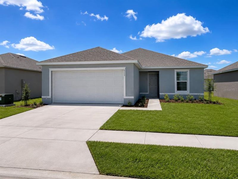 Front exterior of a new home in Poinciana, Poinciana, FL, highlighting curb appeal (Image 1). Front exterior of a new home in Poinciana, Poinciana, FL, highlighting curb appeal (Image 1).