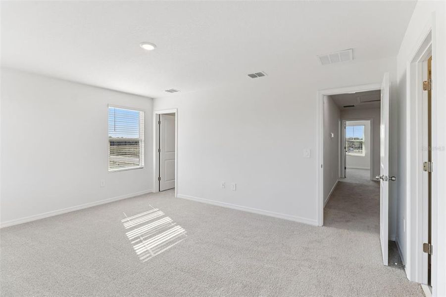 Spacious, unfurnished interior of a new home in The Reserve at Hammock Oaks Townes, Lady Lake (Image 29).